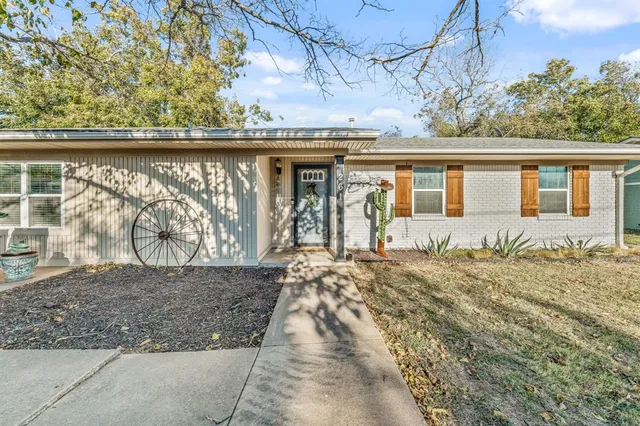 front view of house next to a yard
