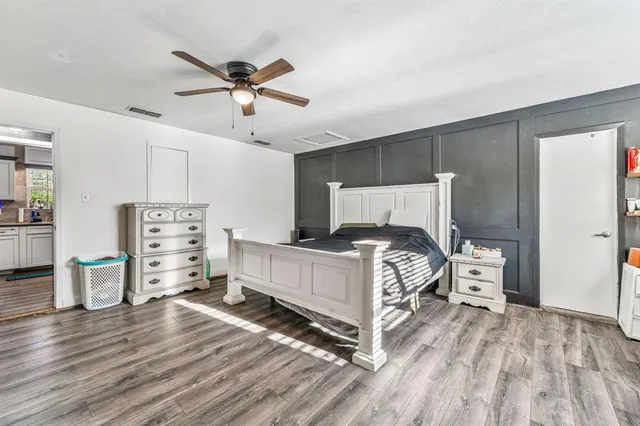 a bed room with a bed and a cabinets