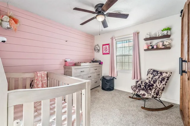 a bedroom with furniture and windows
