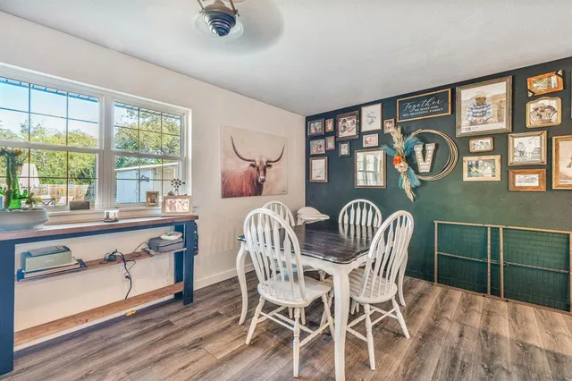 a view of a dining room with furniture window and outside view