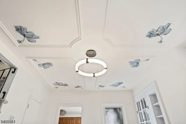 a bathroom with a light fixture and a sink