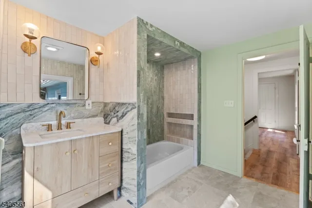 a bathroom with a sink and a mirror