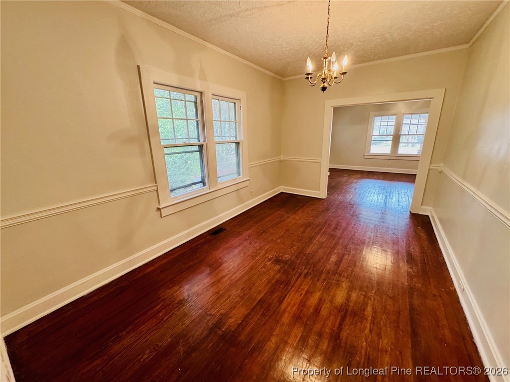411 Carthage Road Lumberton, NC 28358 - Photo 12 of 25 wooden floor in an empty room with a window