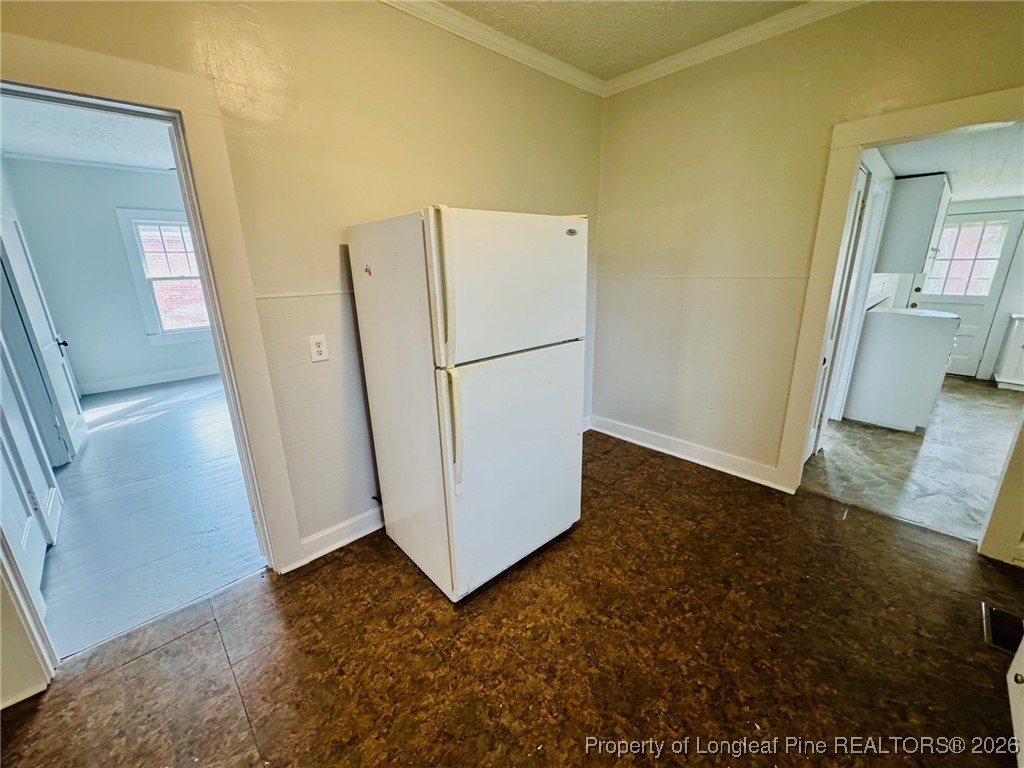 411 Carthage Road Lumberton, NC 28358 - Photo 15 of 25 a view of a storage & utility room with a refrigerator