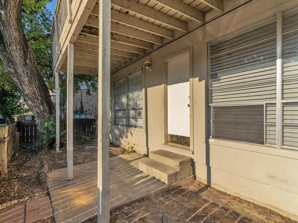 5053 Ridglea Lane, Unit 911 Fort Worth, TX 76116 - Photo 14 of 16 a view of a entryway door front of house