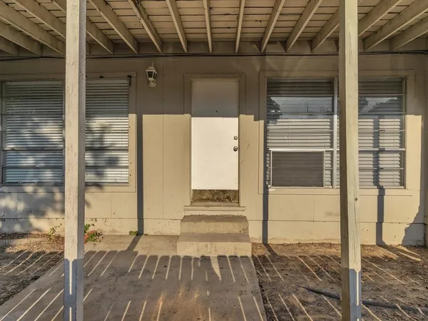 a view of a balcony with a door