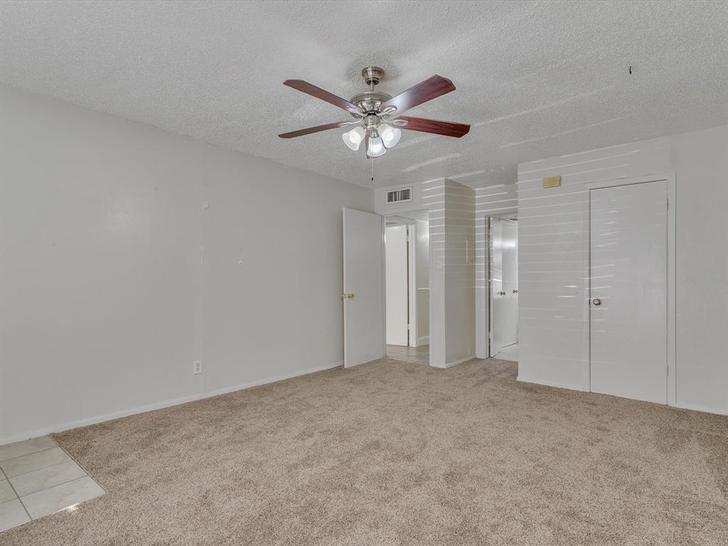 5053 Ridglea Lane, Unit 911 Fort Worth, TX 76116 - Photo 8 of 16 a view of an empty room
