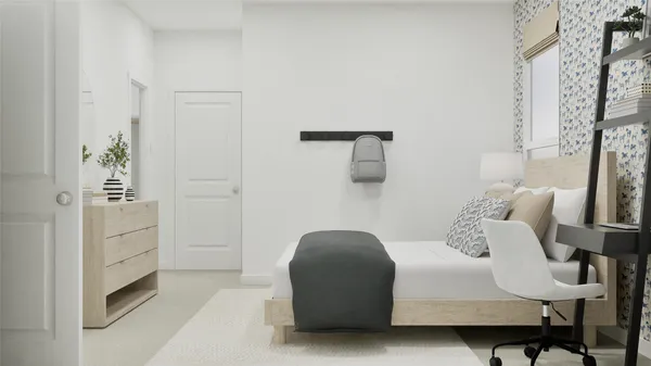 a bedroom with a bed and chair