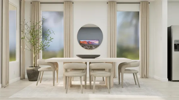 a view of a dining room with furniture and a potted plant