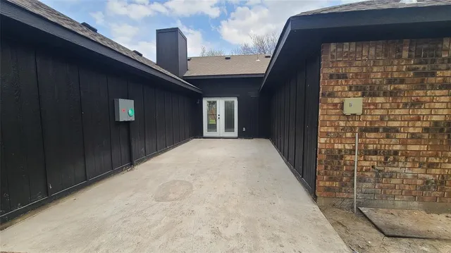 a view of a brick house with a street