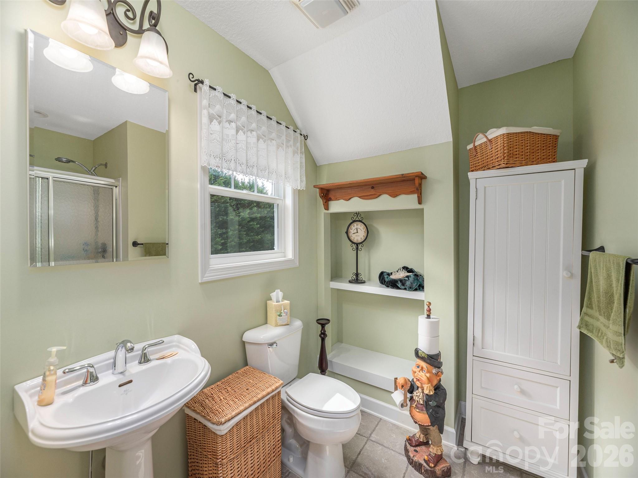 22 Cottage Loop Waynesville, NC 28785 - Photo 15 of 26 a bathroom with a toilet sink and mirror
