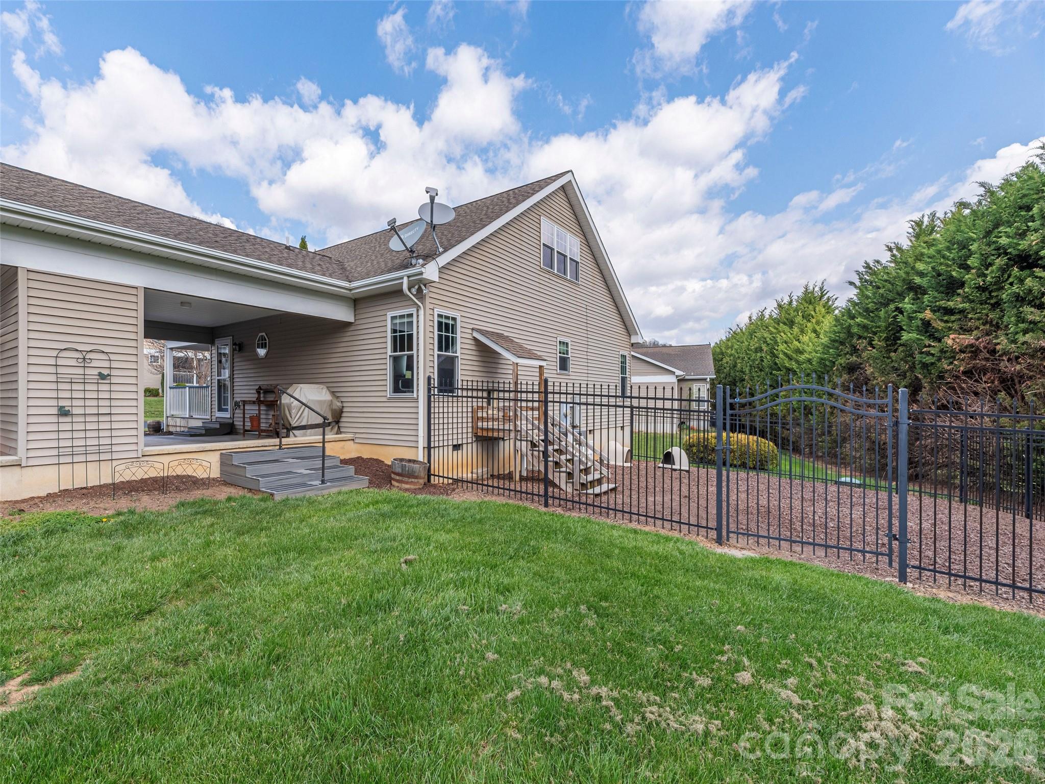 22 Cottage Loop Waynesville, NC 28785 - Photo 24 of 26 a view of a backyard with sitting area and roof