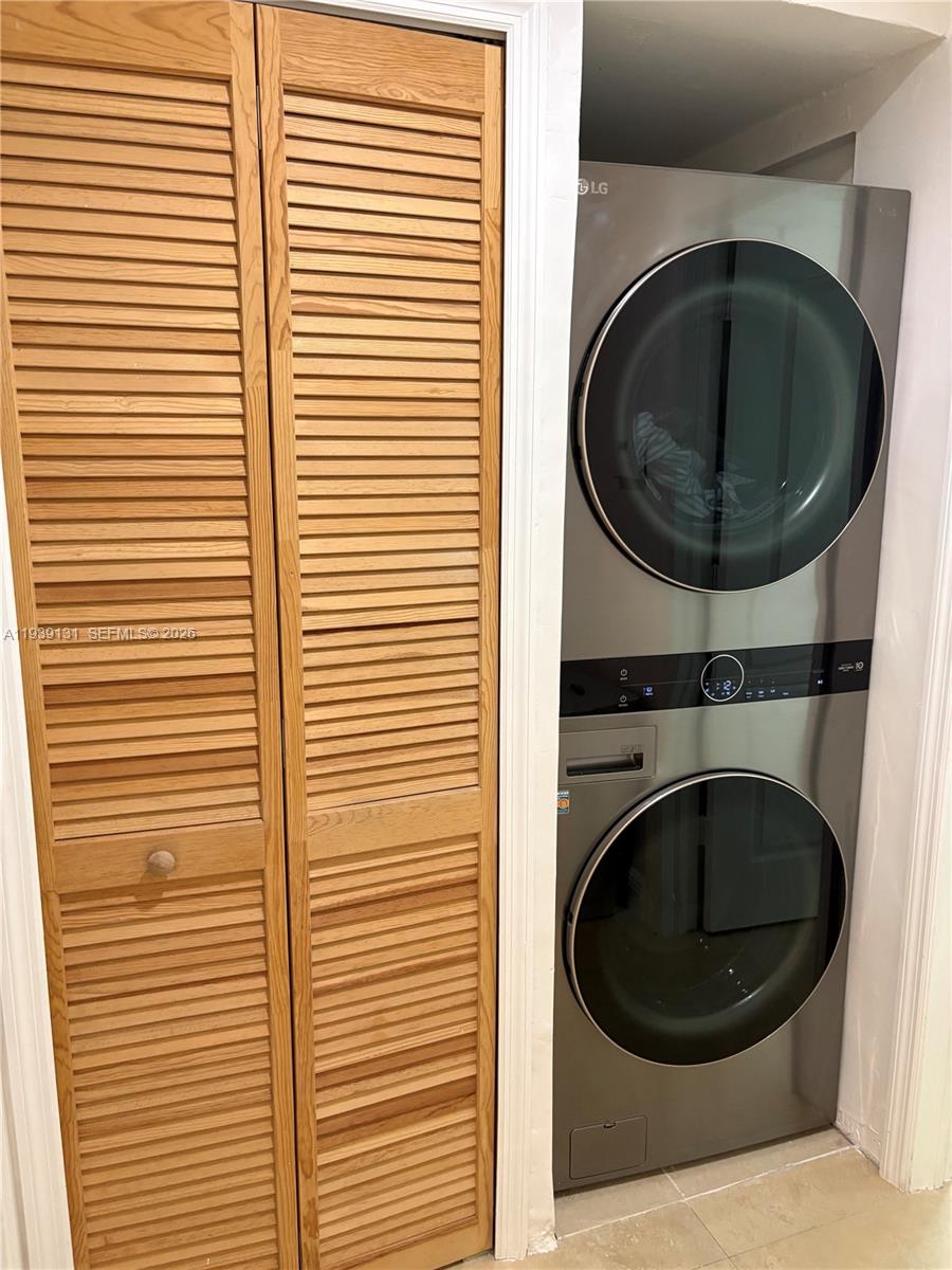 5555 Ludlam Road, Unit 25 South Miami, FL 33155 - Photo 15 of 27 a view of a utility room with washer and dryer