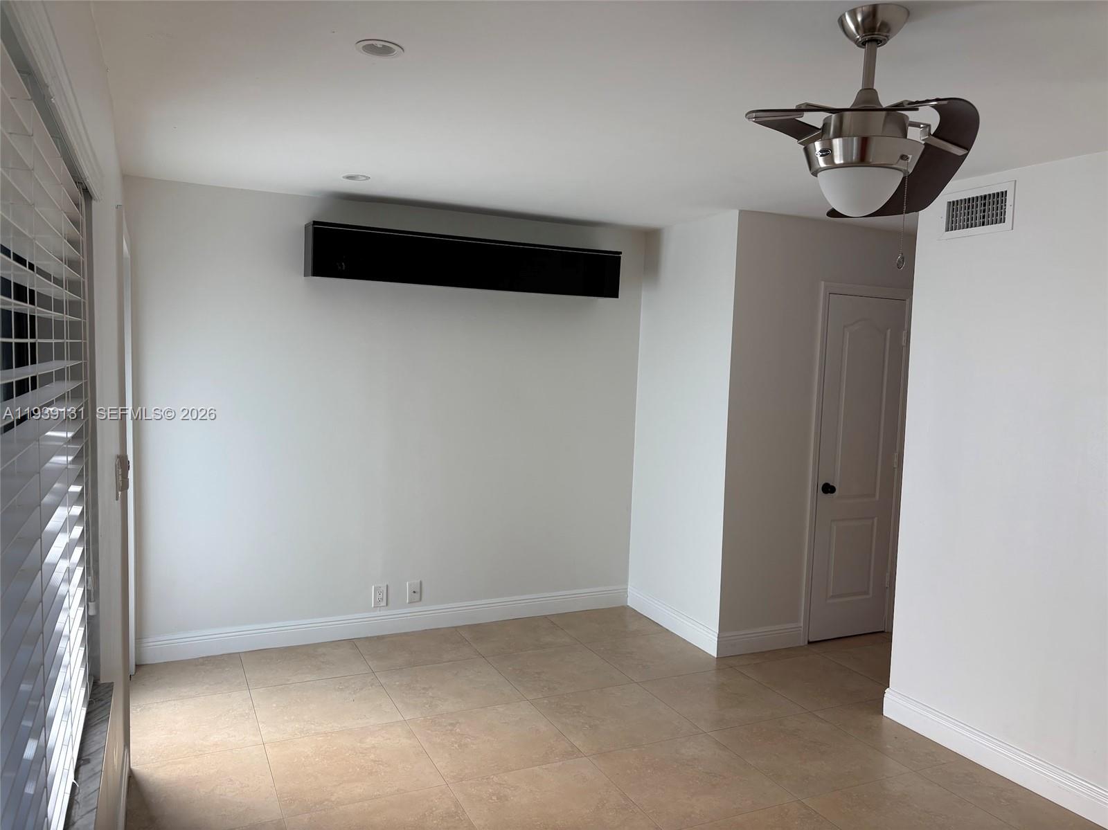 5555 Ludlam Road, Unit 25 South Miami, FL 33155 - Photo 5 of 27 a view of empty room with ceiling fan