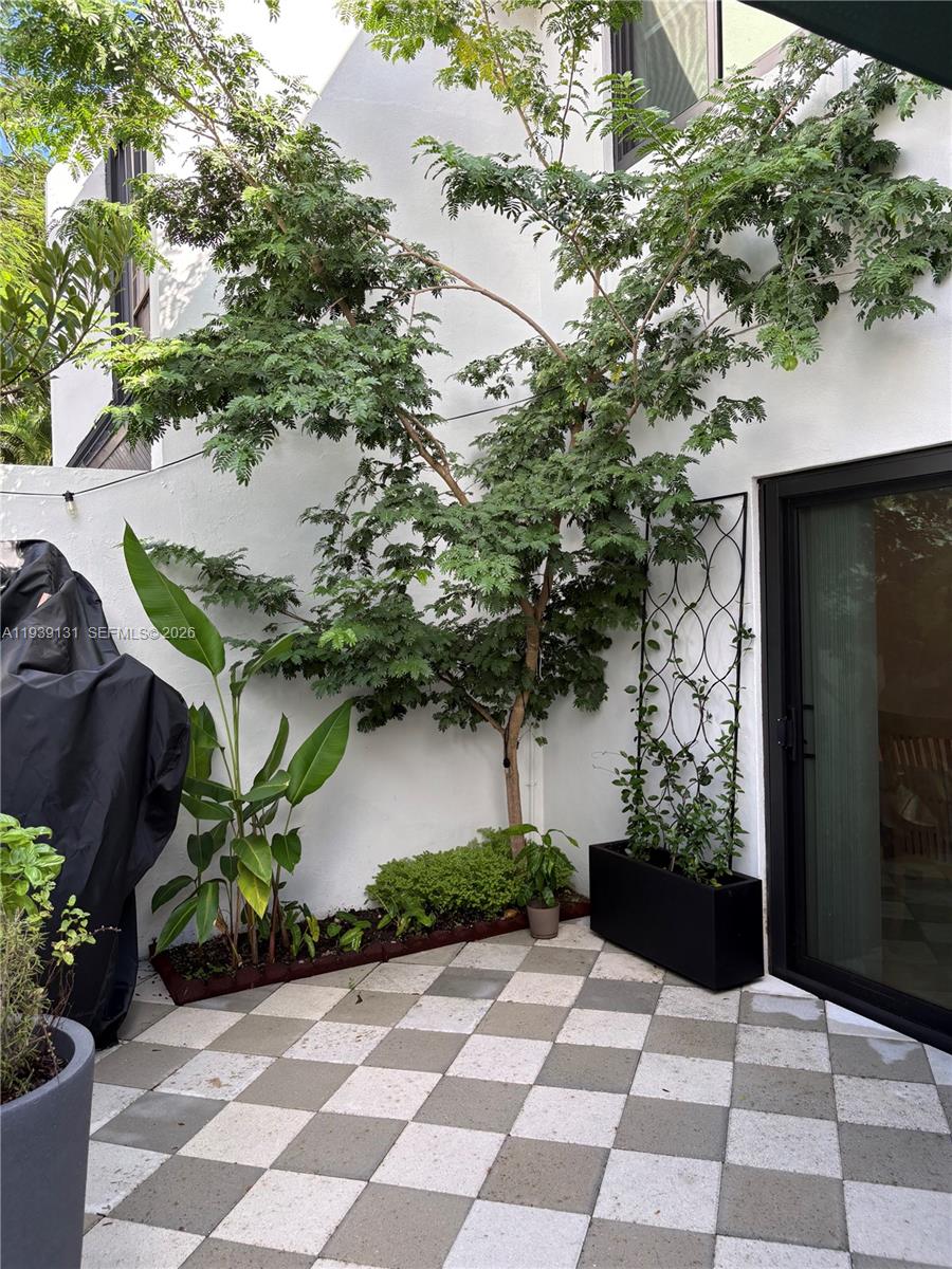 5555 Ludlam Road, Unit 25 South Miami, FL 33155 - Photo 10 of 27 a view of a garden