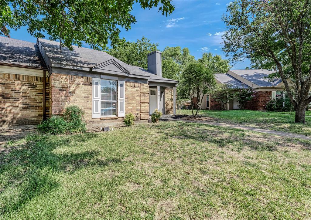 a house with trees in the background
