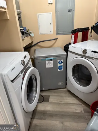 a utility room with dryer and washer