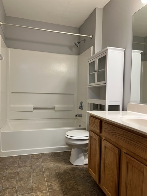 1526 McClure Road, Unit 1526 Aurora, IL 60505 - Photo 9 of 12 a bathroom with a sink a toilet and shower
