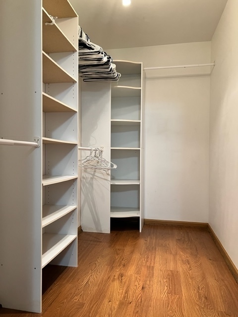 1526 McClure Road, Unit 1526 Aurora, IL 60505 - Photo 10 of 12 a view of walk in closet with empty racks