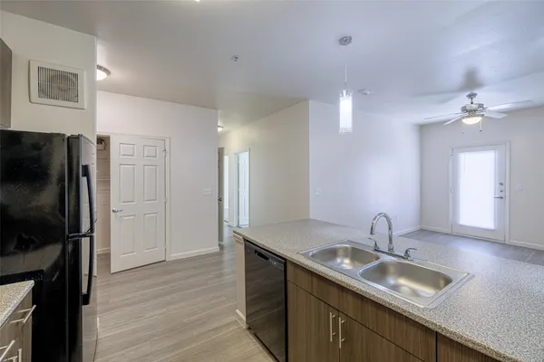 a bathroom with a sink double vanity granite and a mirror