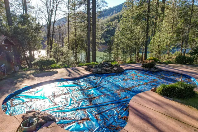 a view of a backyard with sitting area