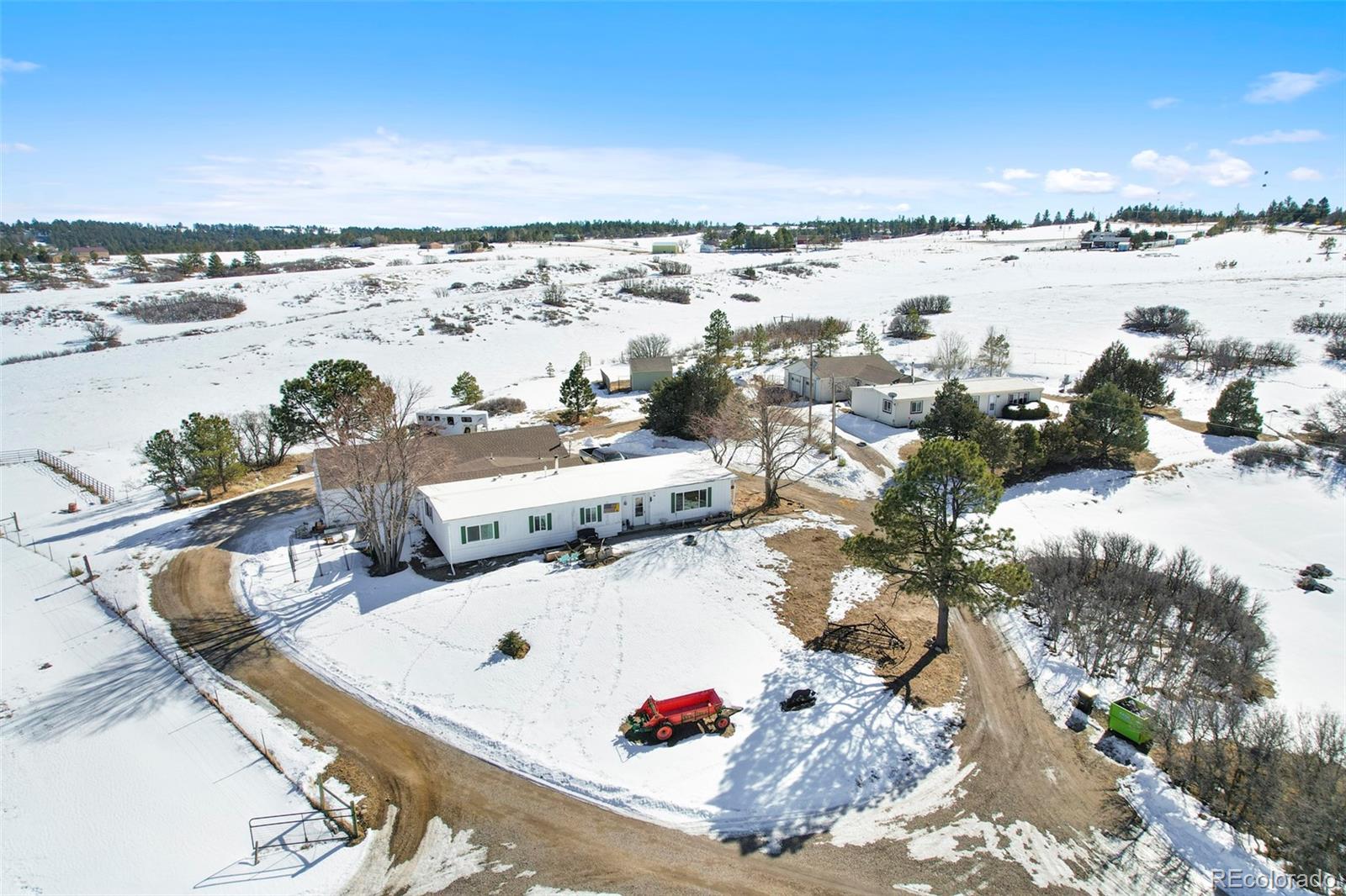 1382 Flintwood Road Franktown, CO 80116 - Photo 2 of 40 a view of a terrace with sky view
