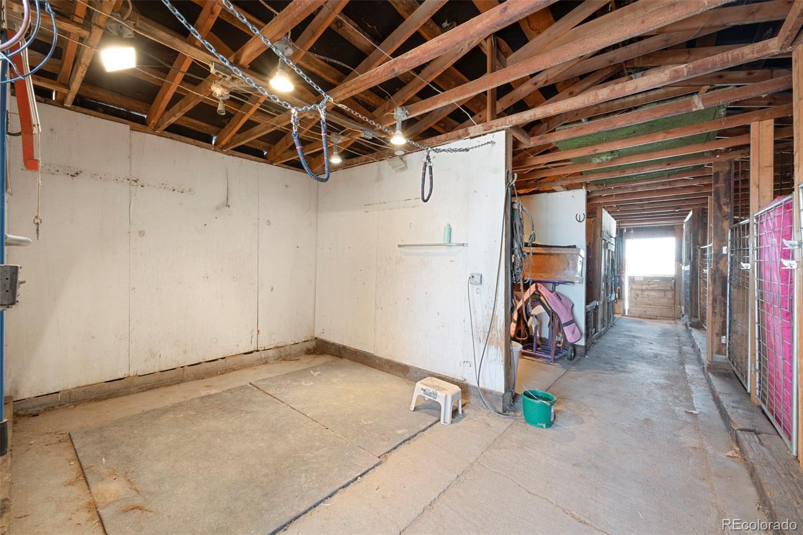 1382 Flintwood Road Franktown, CO 80116 - Photo 34 of 40 a view of a room with gym equipment