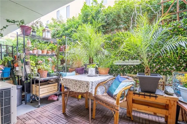 a outdoor space with a table and chairs