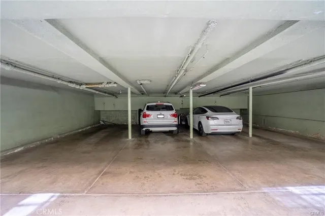a view of a room with table and chairs