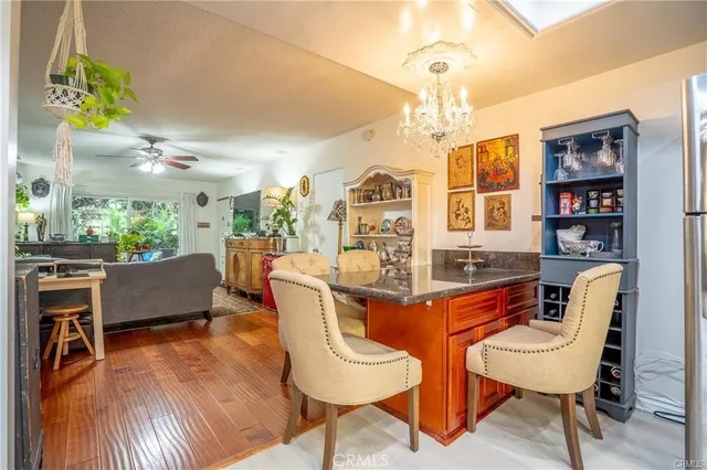 a dining room with furniture a rug and wooden floor