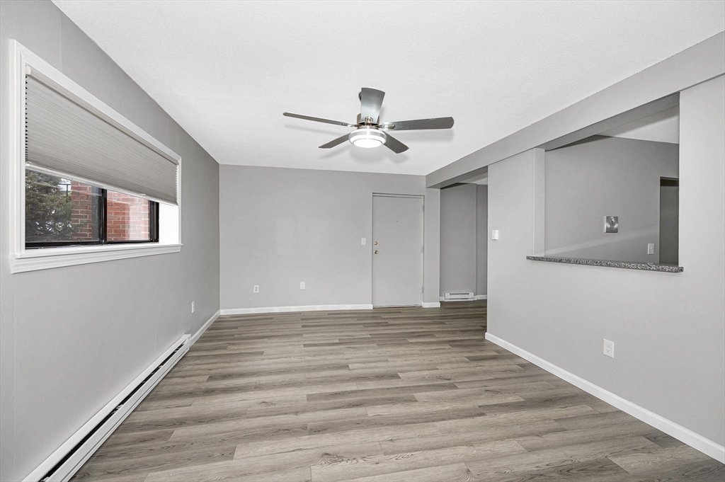 1241 Lawrence Street, Unit 101 Lowell, MA 01852 - Photo 11 of 27 a view of an empty room with a window