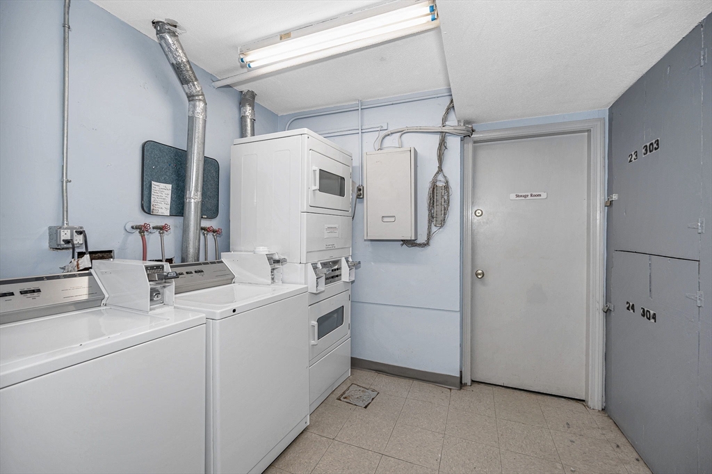 1241 Lawrence Street, Unit 101 Lowell, MA 01852 - Photo 19 of 27 a bathroom with a sink and a mirror