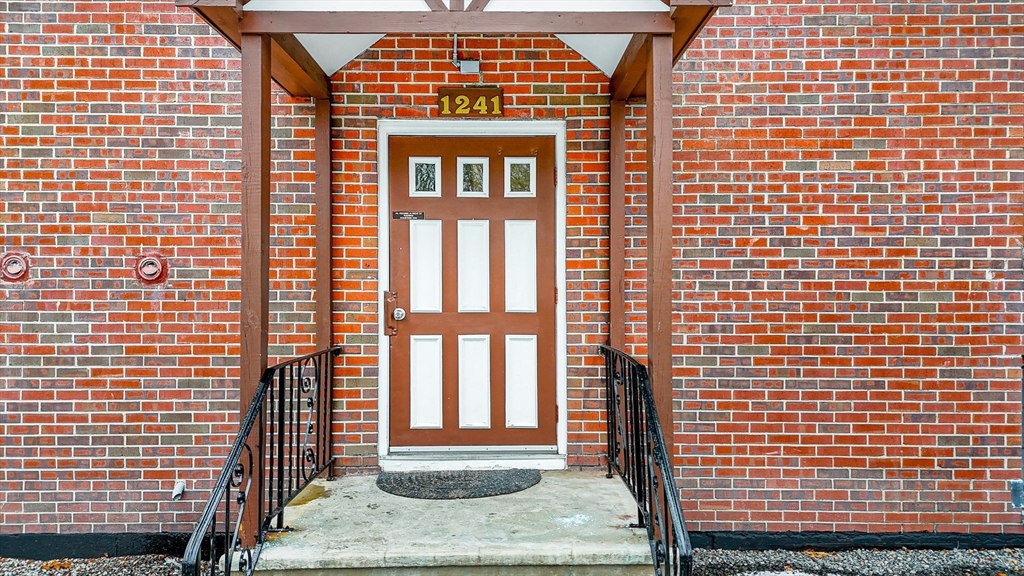1241 Lawrence Street, Unit 101 Lowell, MA 01852 - Photo 22 of 27 a front view of a building