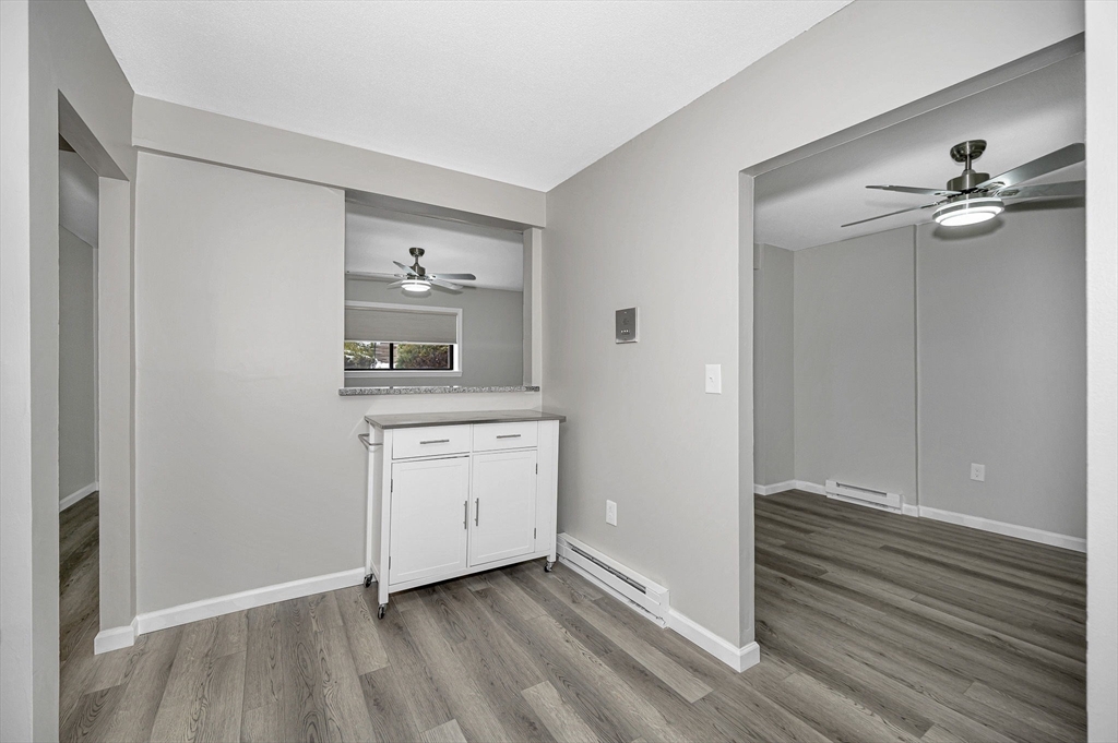 1241 Lawrence Street, Unit 101 Lowell, MA 01852 - Photo 6 of 27 a view of a kitchen from the hallway