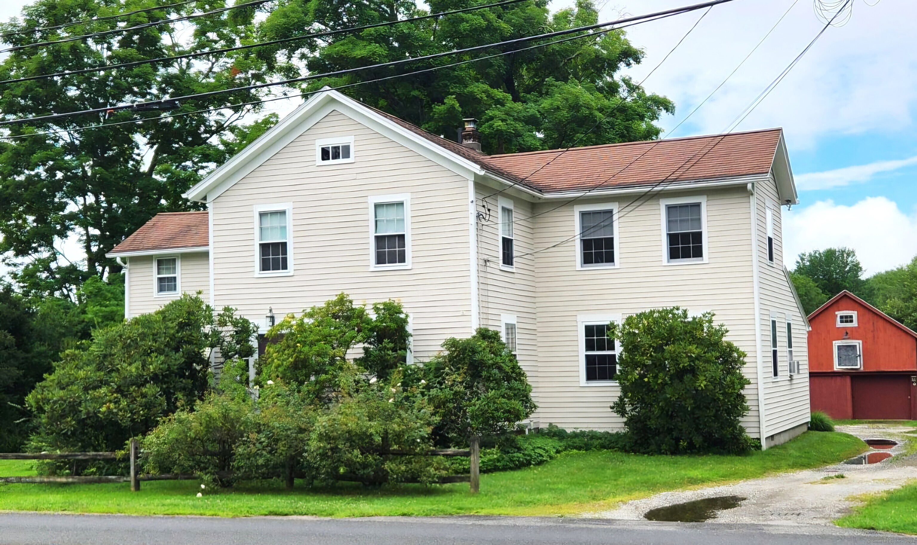 13 South Street Roxbury, CT 06783 - Photo 1 of 1 a front view of a house with a yard