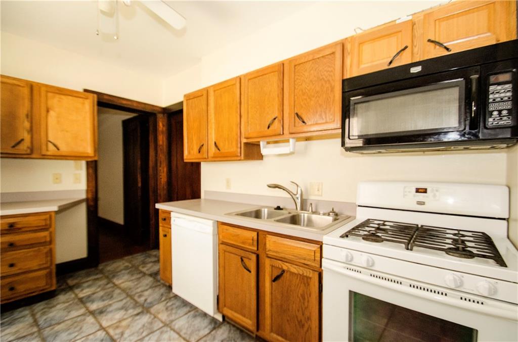 305 Rhodes Place New Castle, PA 16101 - Photo 10 of 16 Kitchen With Pocket and Swinging Door