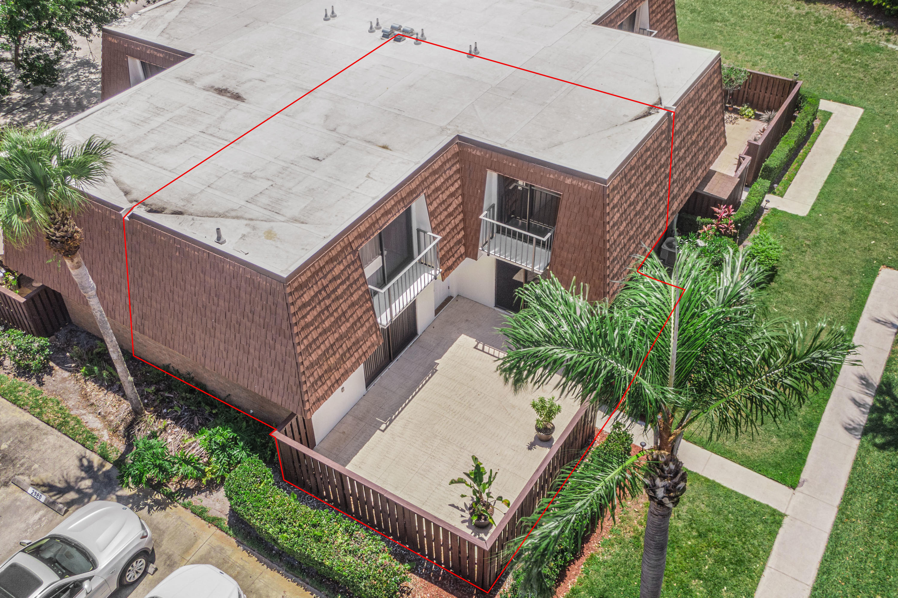 2980 Southwest Sunset Trace Circle Palm City, FL 34990 - Photo 2 of 21 an aerial view of a house with a garden and deck