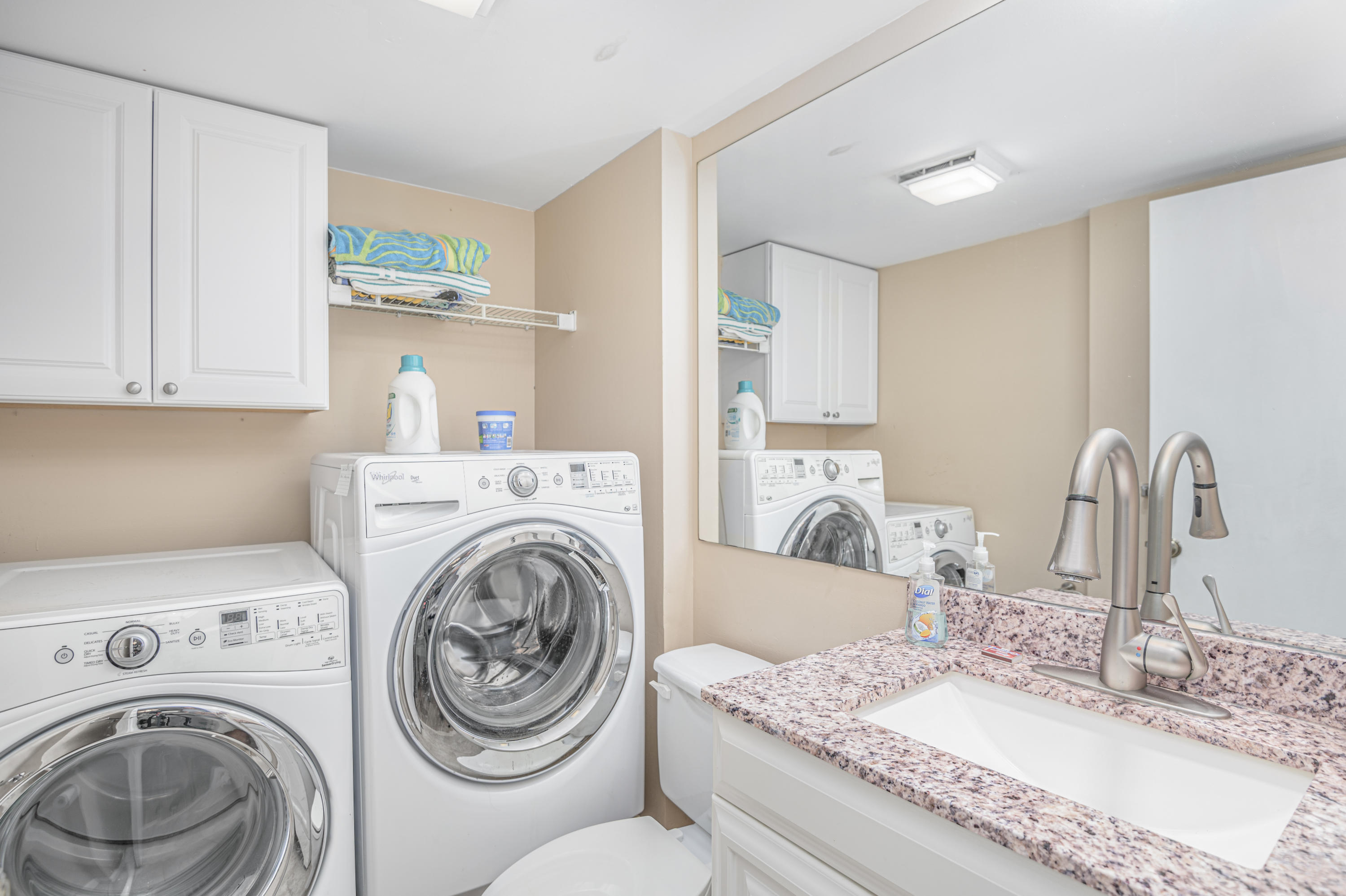 2980 Southwest Sunset Trace Circle Palm City, FL 34990 - Photo 11 of 21 a bathroom with a granite countertop a sink and a mirror