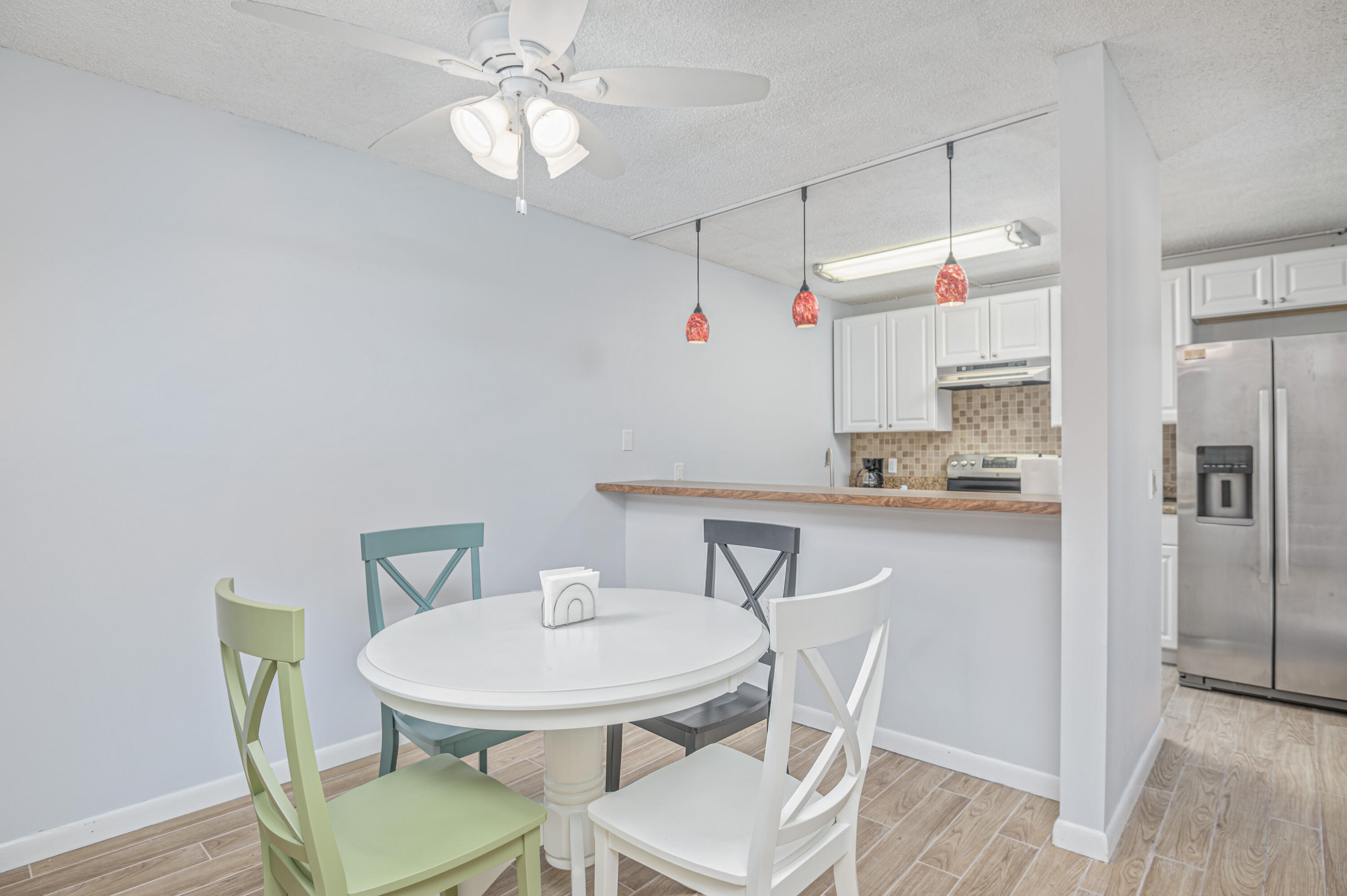 2980 Southwest Sunset Trace Circle Palm City, FL 34990 - Photo 7 of 21 a view of a dining room with furniture and wooden floor