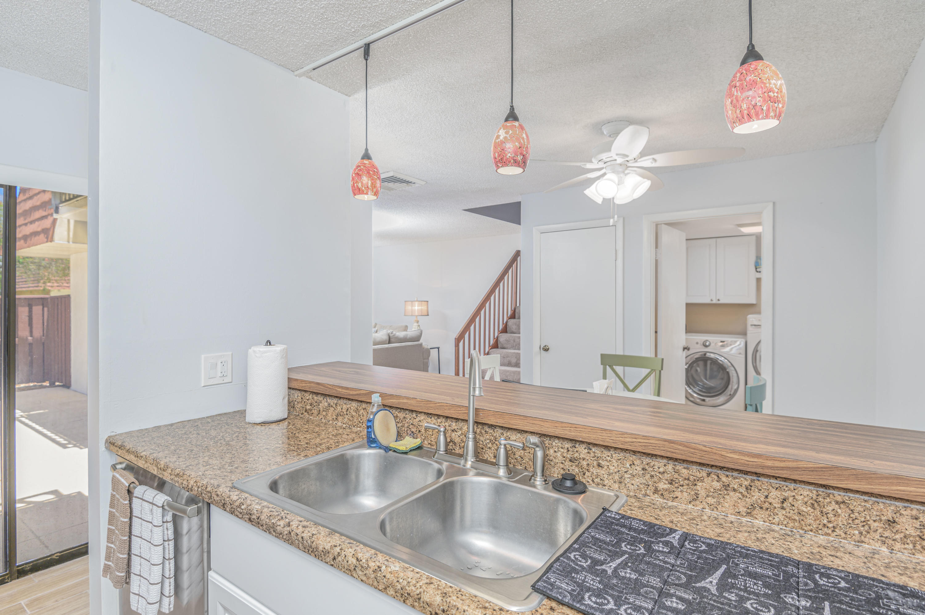 2980 Southwest Sunset Trace Circle Palm City, FL 34990 - Photo 9 of 21 a view of living room with granite countertop furniture and fireplace
