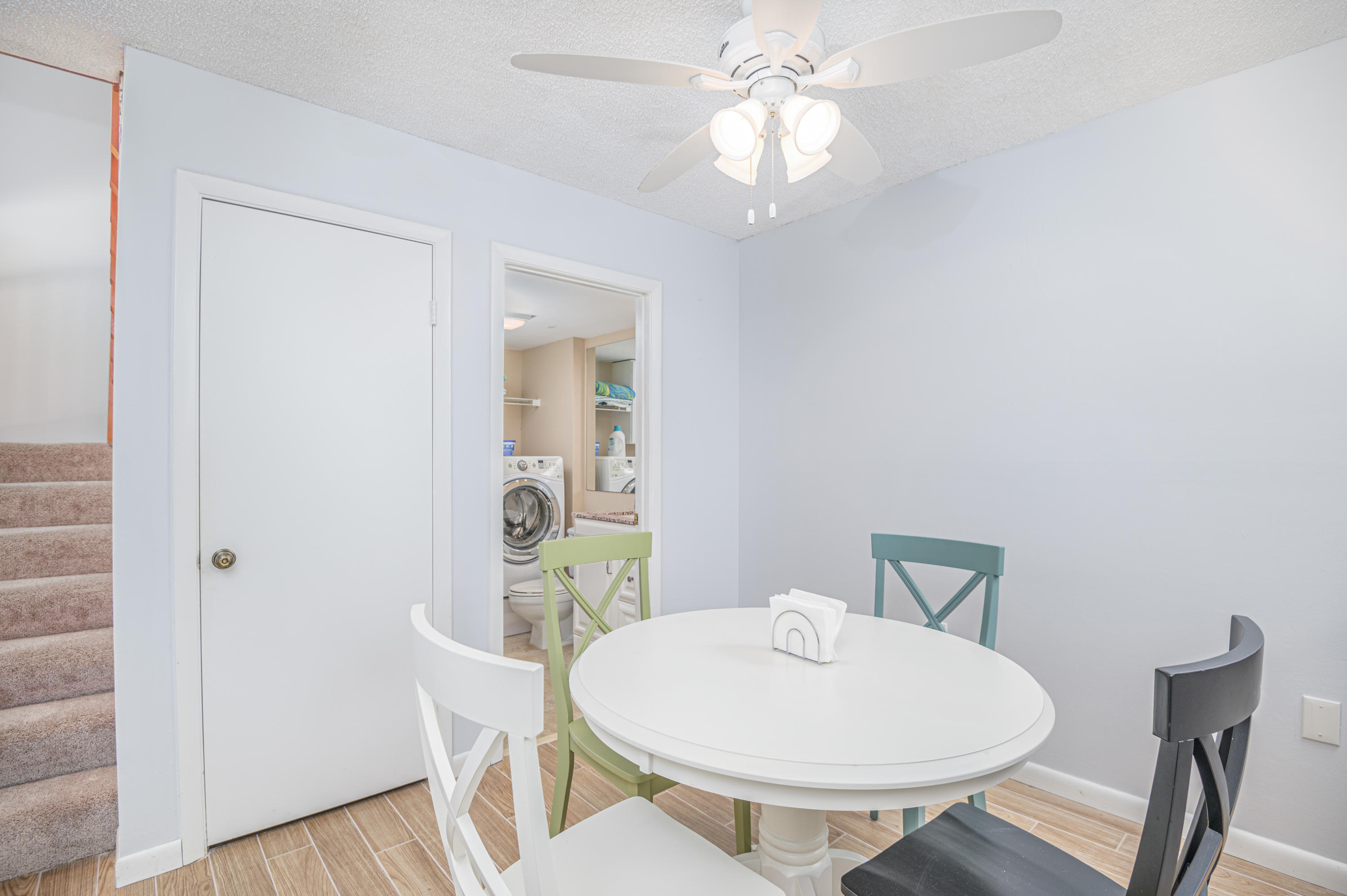 2980 Southwest Sunset Trace Circle Palm City, FL 34990 - Photo 10 of 21 a view of a dining room with furniture and wooden floor