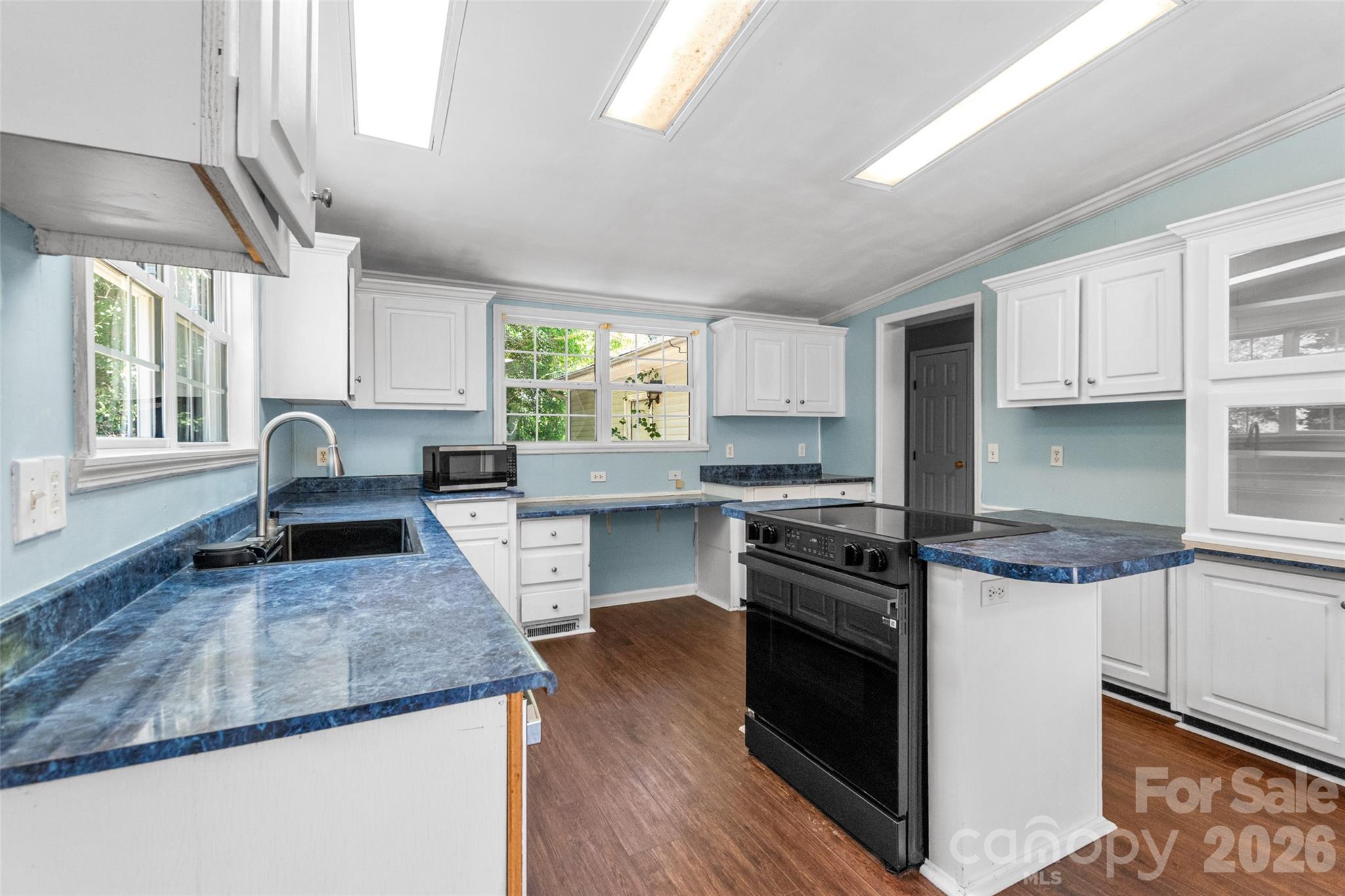 434 Rutledge Drive Catawba, SC 29704 - Photo 13 of 39 a kitchen with a stove sink and cabinets