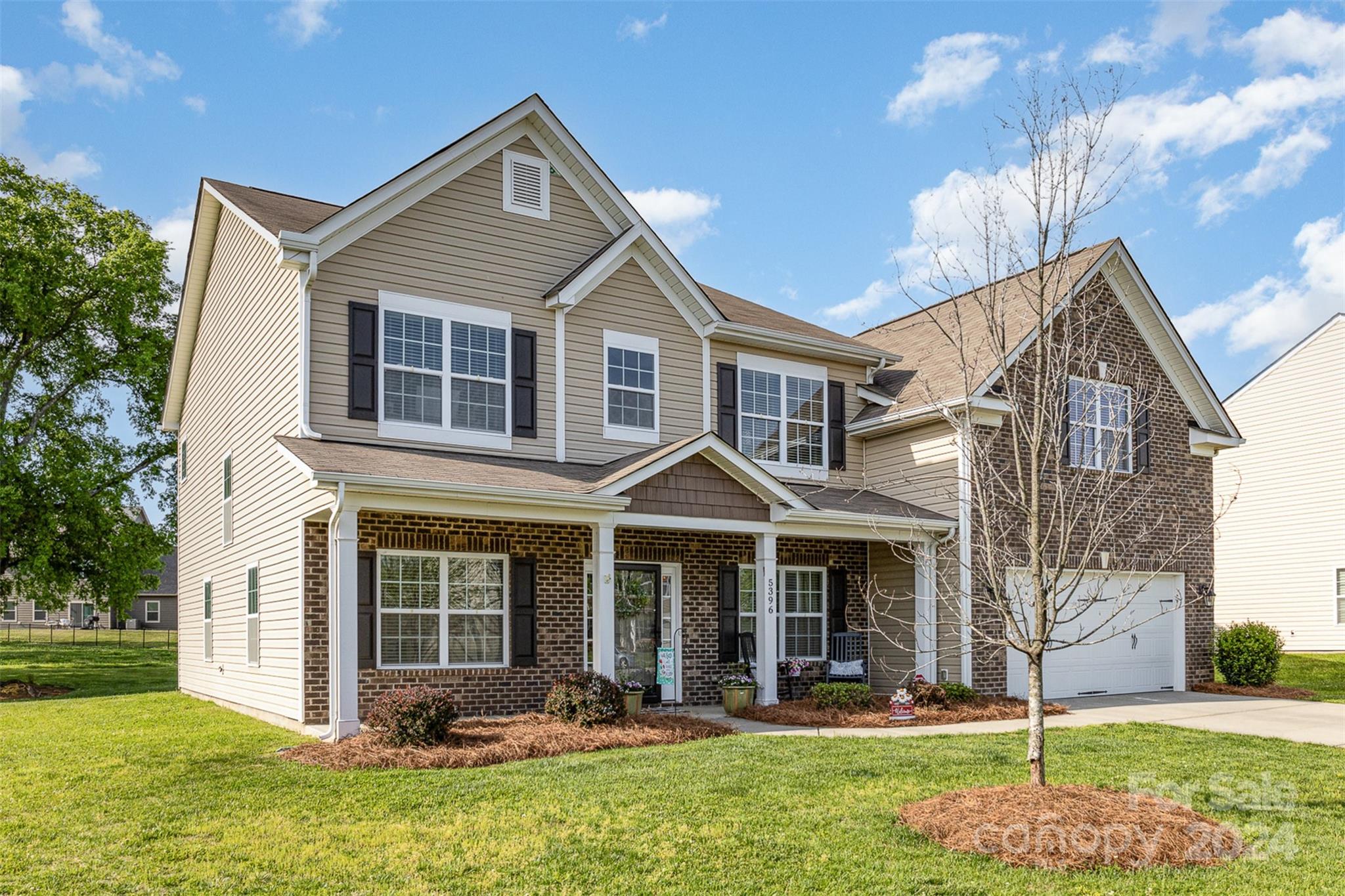 5396 Hackberry Lane Southwest Concord, NC 28027 - Photo 2 of 31 a front view of a house with a yard