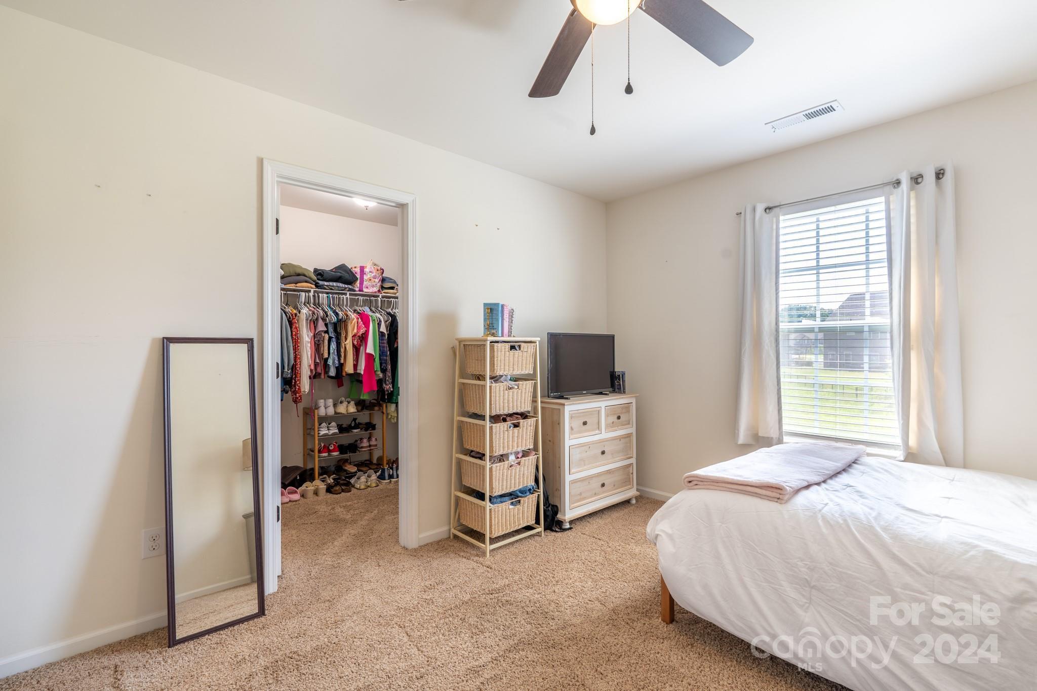 5396 Hackberry Lane Southwest Concord, NC 28027 - Photo 26 of 31 a bedroom with a bed and a window