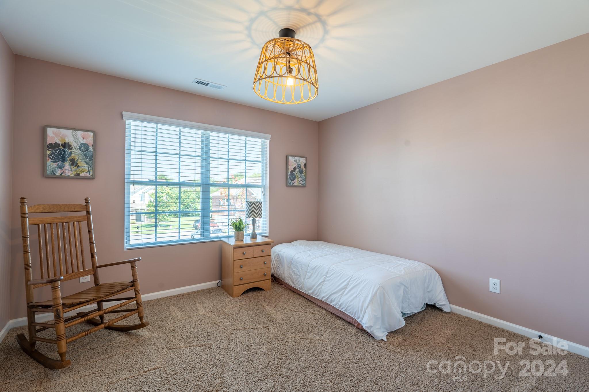 5396 Hackberry Lane Southwest Concord, NC 28027 - Photo 27 of 31 a bedroom with a bed and a window