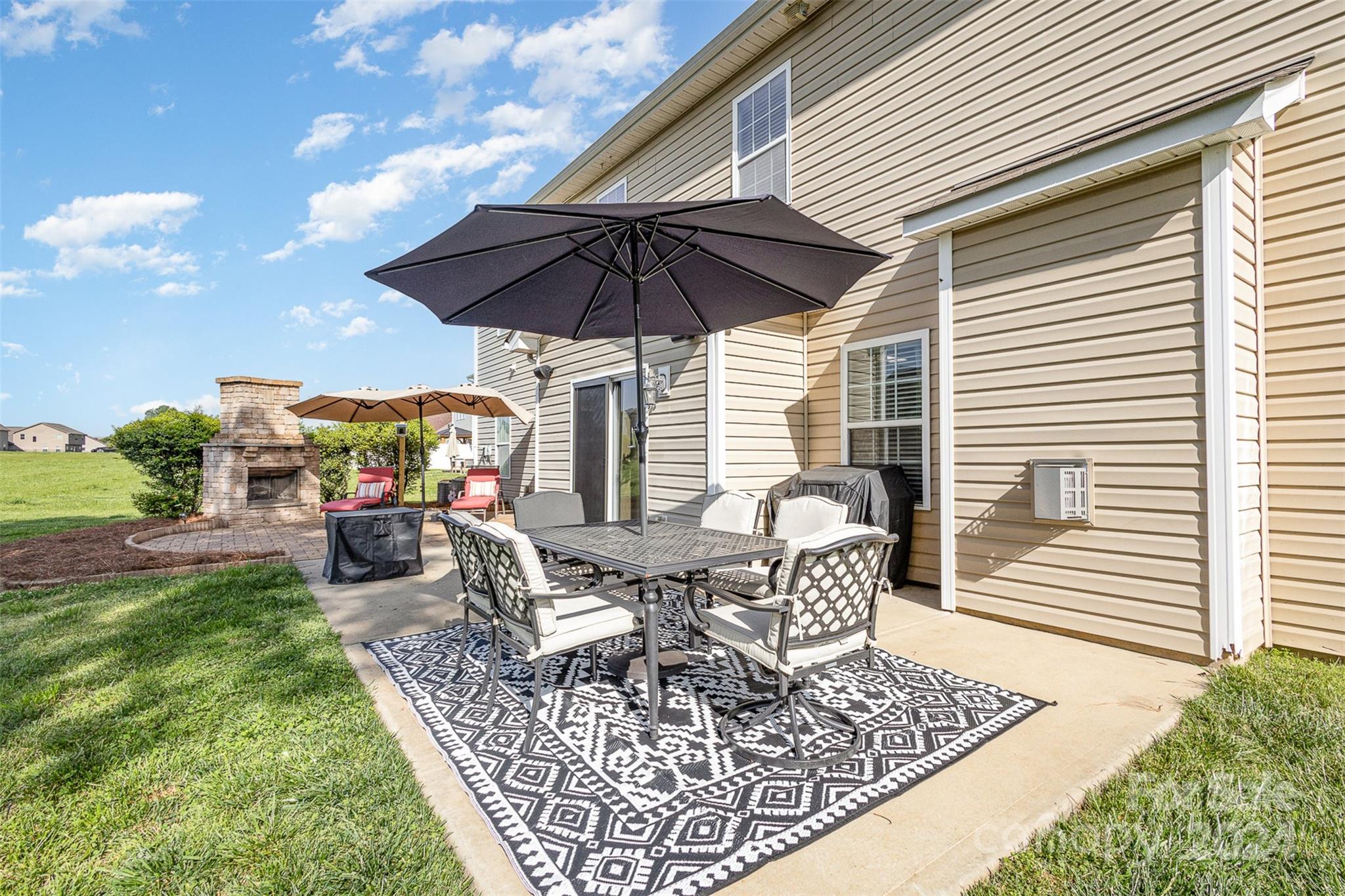 5396 Hackberry Lane Southwest Concord, NC 28027 - Photo 3 of 31 a view of an outdoor sitting area with furniture