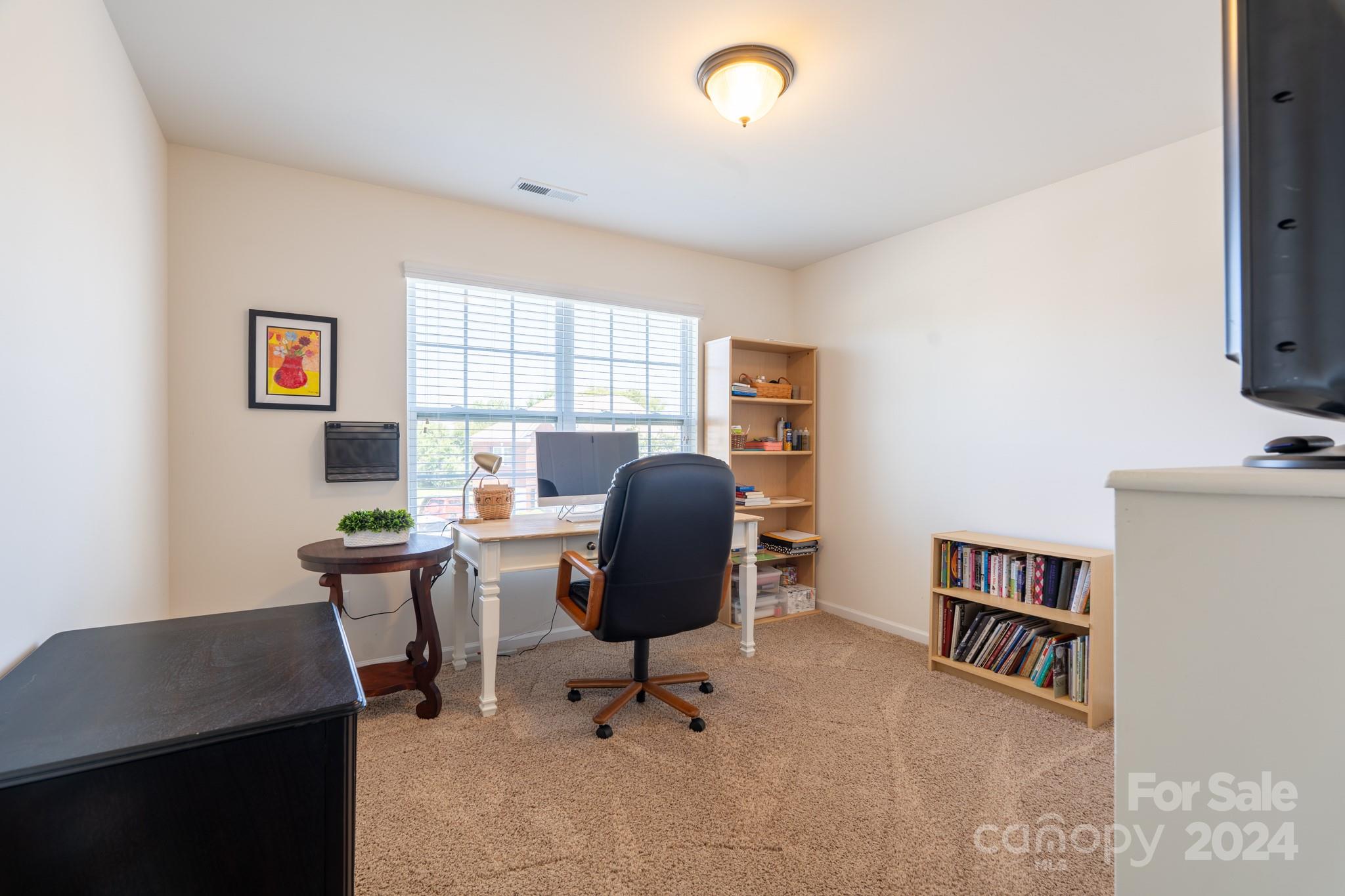 5396 Hackberry Lane Southwest Concord, NC 28027 - Photo 31 of 31 a view of a workspace with furniture and a window