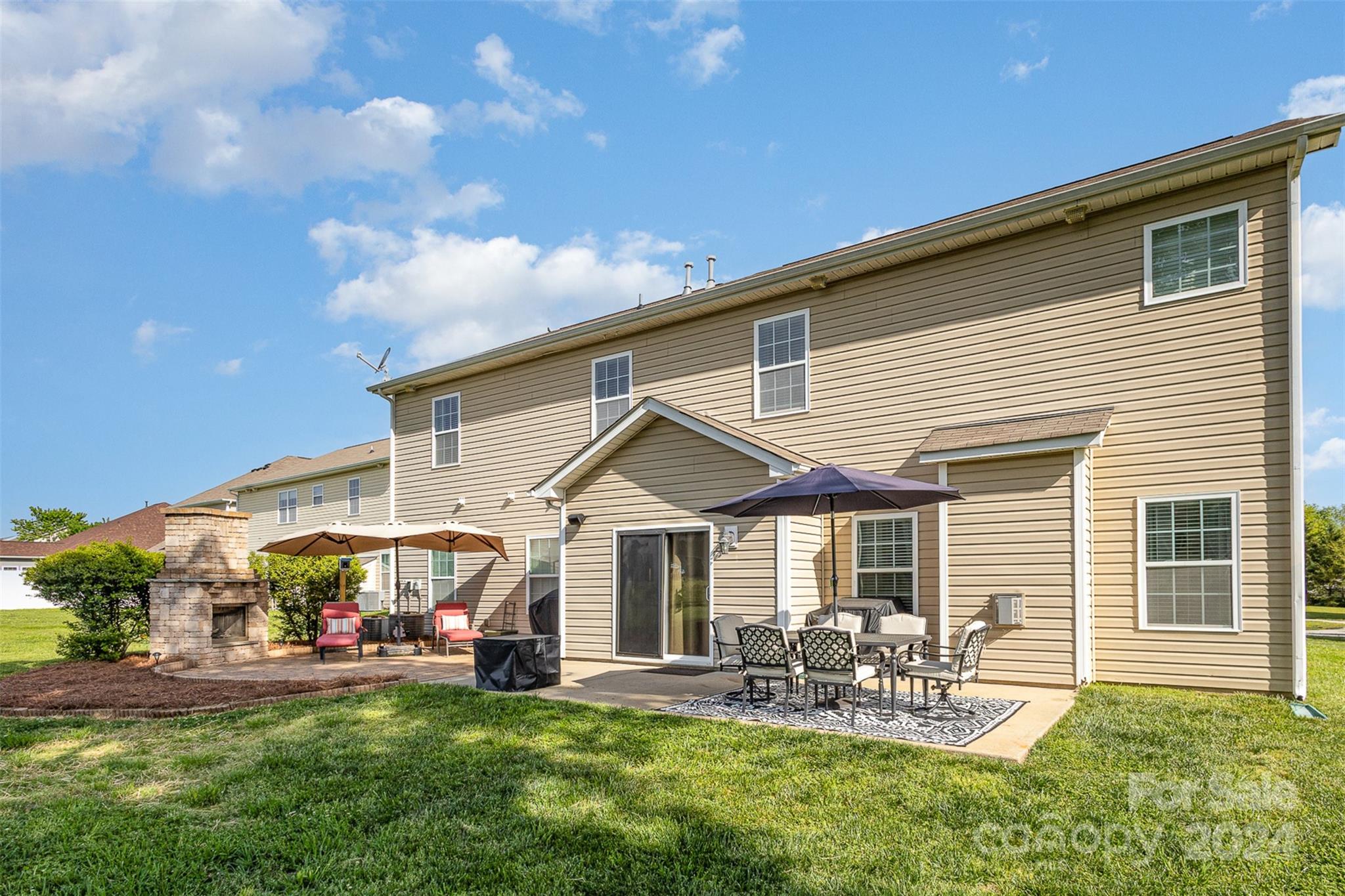 5396 Hackberry Lane Southwest Concord, NC 28027 - Photo 6 of 31 a front view of house with yard and outdoor seating