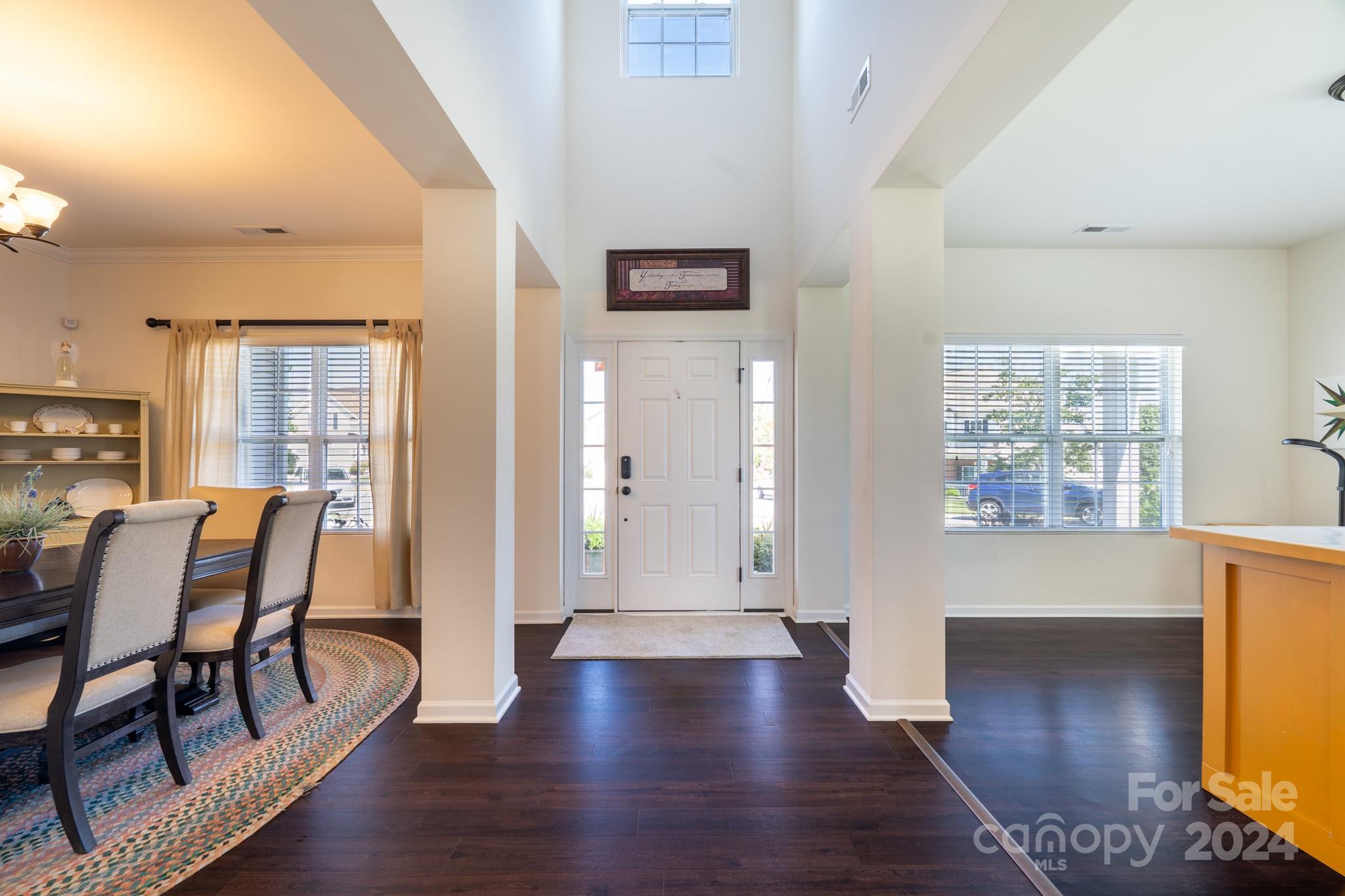 5396 Hackberry Lane Southwest Concord, NC 28027 - Photo 7 of 31 a view of a hallway with furniture and wooden floor