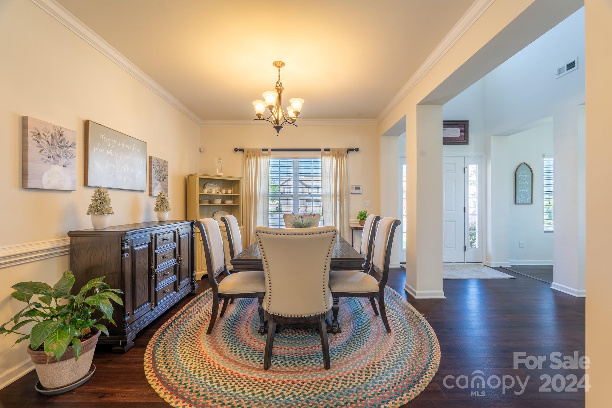 5396 Hackberry Lane Southwest Concord, NC 28027 - Photo 10 of 31 a view of a dining room with furniture window and wooden floor